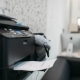 Copier with contract, equipment in business office, Secretary at the workplace on background. Printer on the table in company