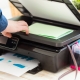 Man's hand making copies. Working with printer