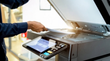 Bussiness man Hand press button on panel of printer, printer scanner laser office copy machine supplies start concept.